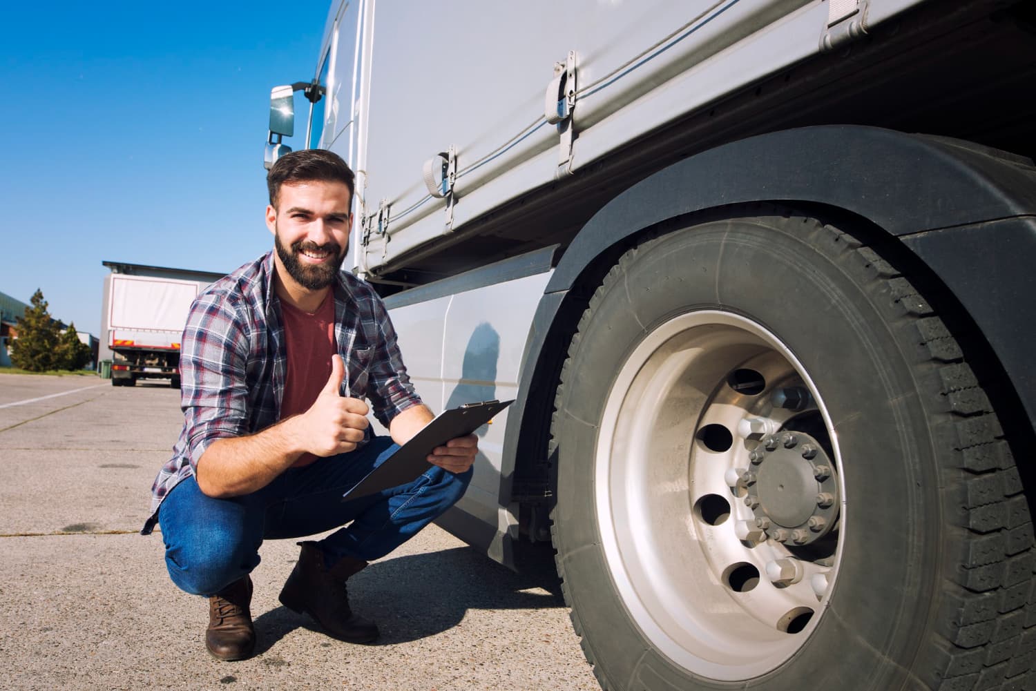 Driver inspecting his truck